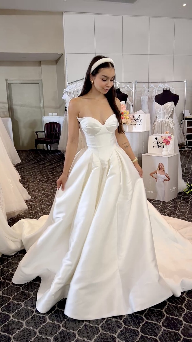 Model in a satin ball gown at the show